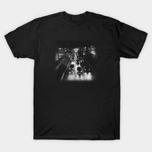 A black photo of cars on a highway at night. T-Shirt